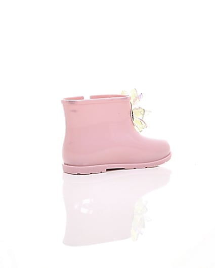 360 degree animation of product Mini girls pink patent 3D embellished wellies frame-12