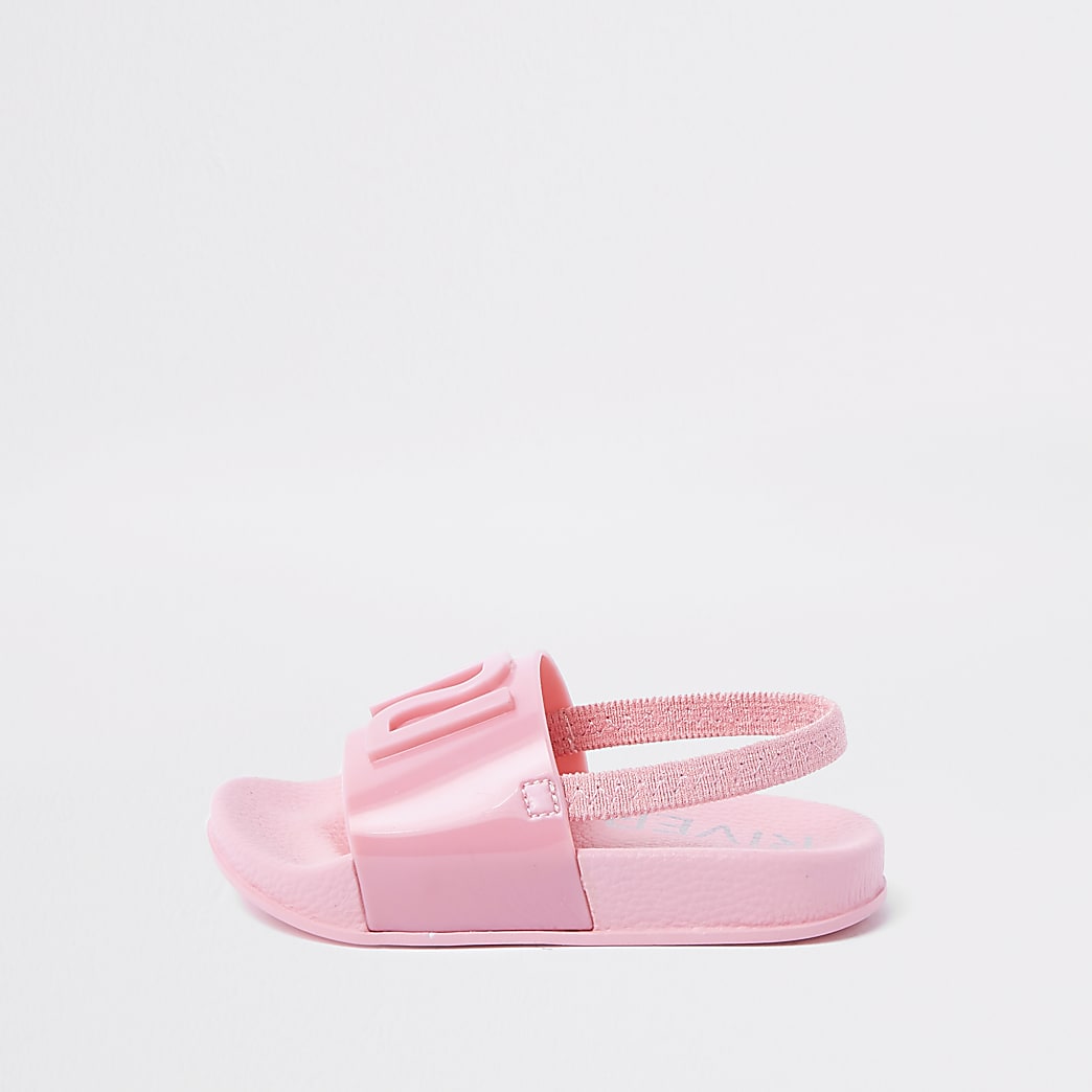 Mini girls pink RI jelly sliders | River Island