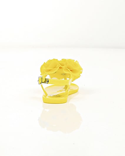 360 degree animation of product Mini girls yellow ruffle jelly sandals frame-15