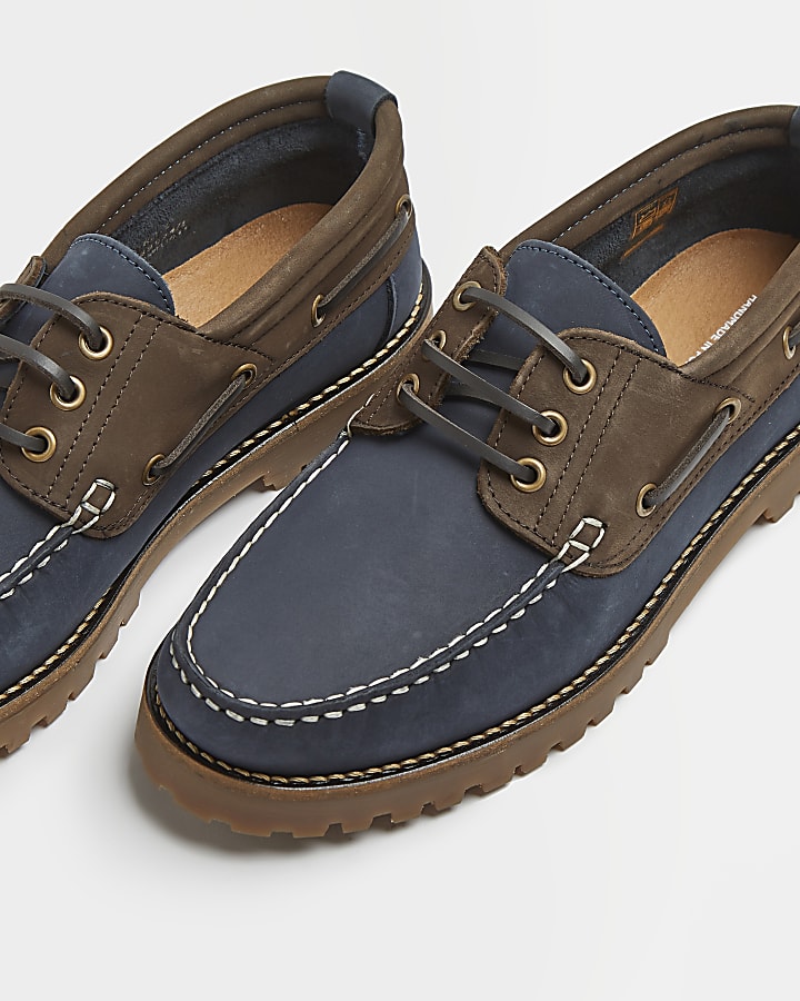 Navy and brown leather cleated boat shoes