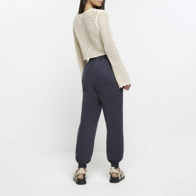 Navy lyocell cuffed joggers River Island
