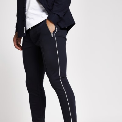 Navy piped super skinny smart joggers | River Island