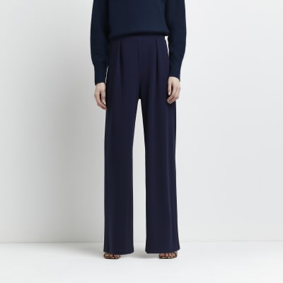 navy pleated trousers