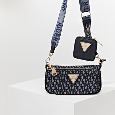 Navy pouchette RI monogram cross body handbag | River Island