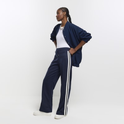 https://images.riverisland.com/is/image/RiverIsland/navy-side-stripe-wide-leg-joggers_905516_main