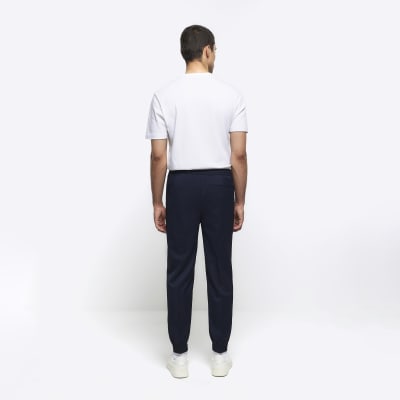 Navy slim fit cuffed smart joggers | River Island