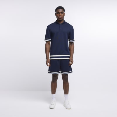 Navy slim fit taped polo shirt | River Island