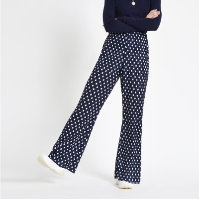Navy spot print plisse flare trousers