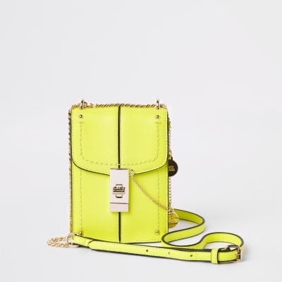 Neon yellow lock front cross body bag