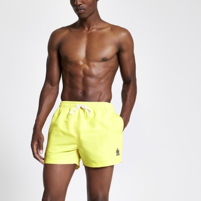 neon yellow swimming trunks