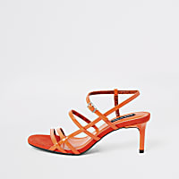 Orange caged skinny heel sandals