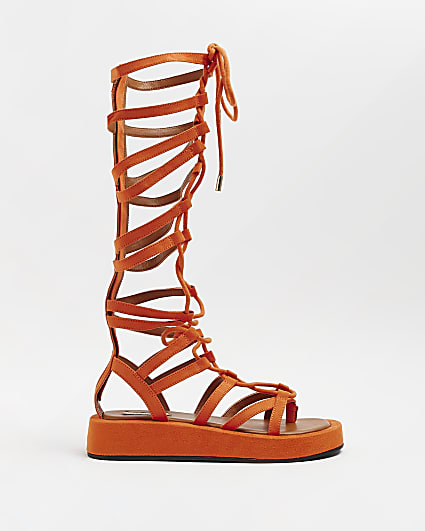 Orange high leg gladiator sandals