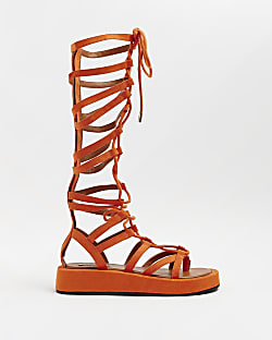 Orange high leg gladiator sandals