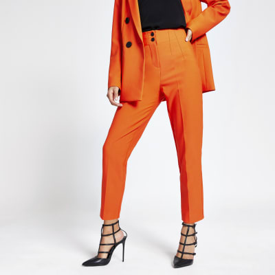 orange cigarette trousers