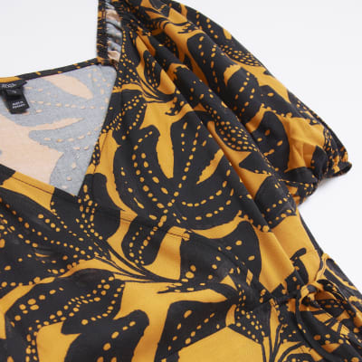 Orange leaf print wrap midi dress