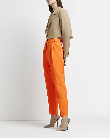 Orange pleated tapered trousers