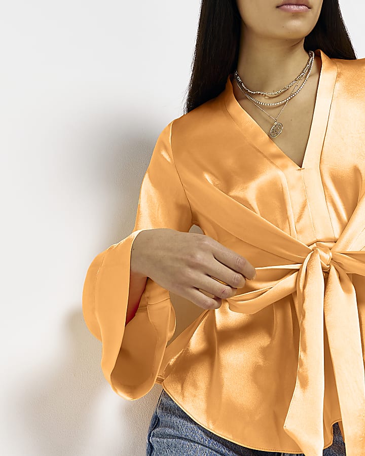 Orange satin tie front long sleeve blouse