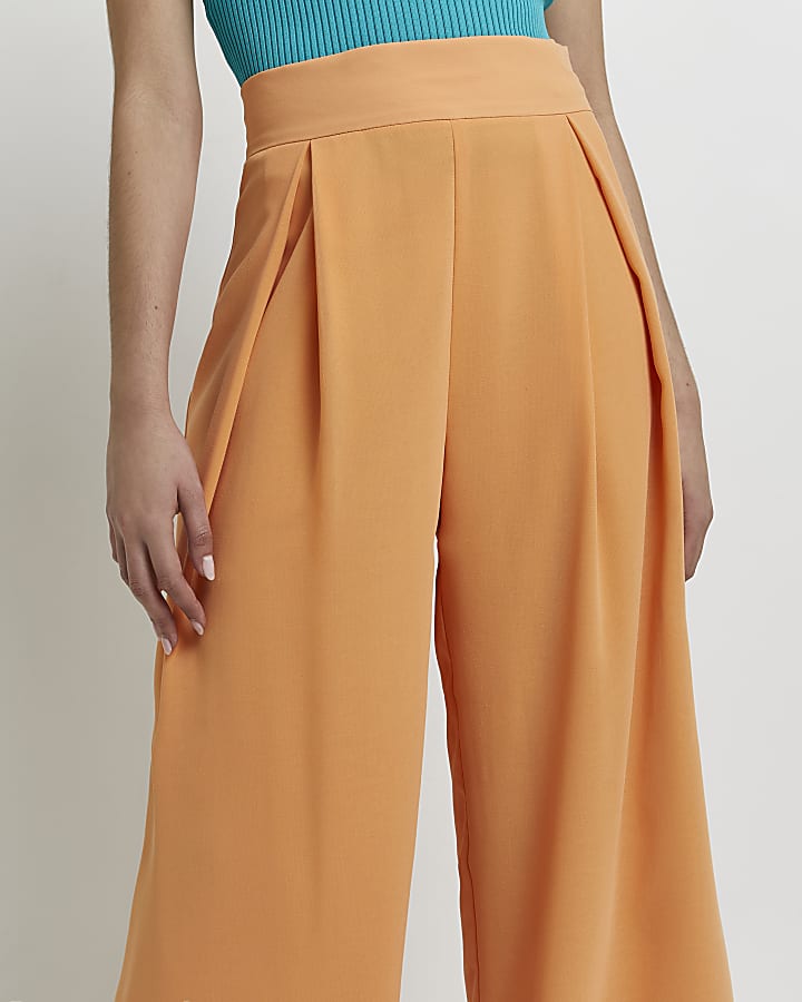 Orange wide leg pleated trousers