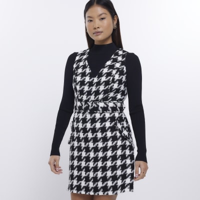 Petite black dogtooth pinafore mini dress River Island