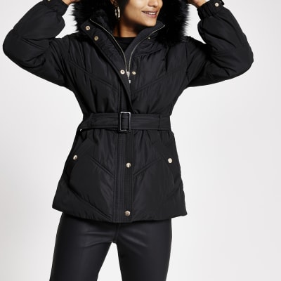 Petite black faux fur hood belt puffer jacket | River Island