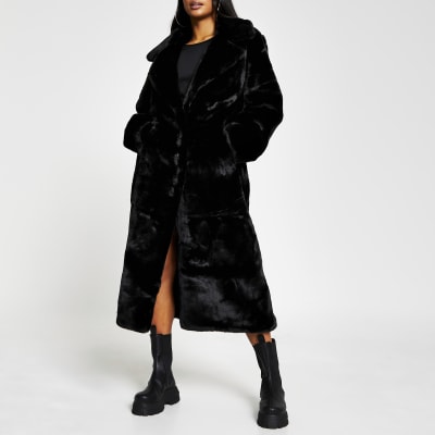 Petite black faux fur long line coat | River Island
