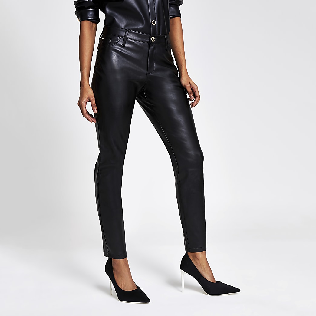 Petite black faux leather Molly trousers | River Island