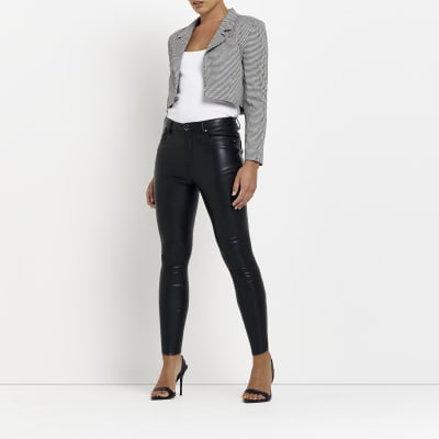 Petite black faux leather skinny trousers