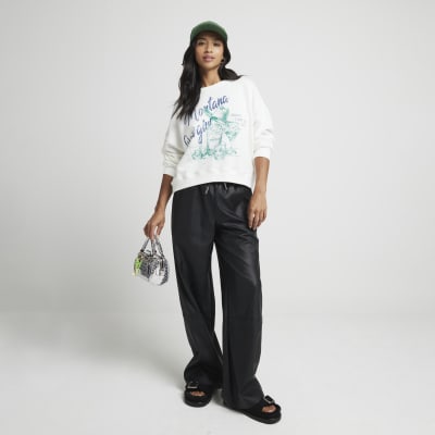 Petite black faux leather wide leg trousers