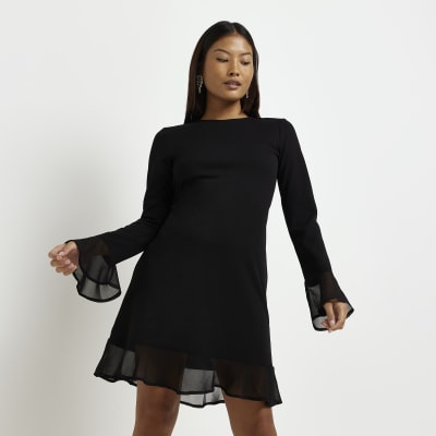 Petite black long sleeve swing mini dress | River Island