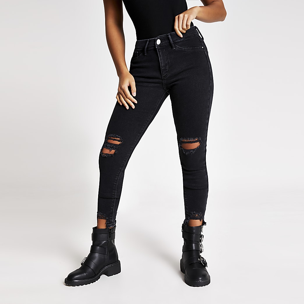 Petite black ripped Molly mid rise jeggings | River Island