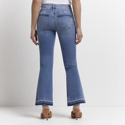 Petite blue mid rise flared jeans River Island