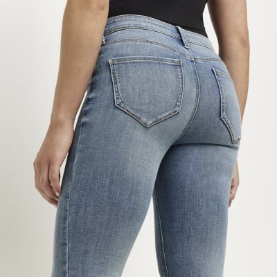 Petite blue Molly mid rise skinny jeans | River Island