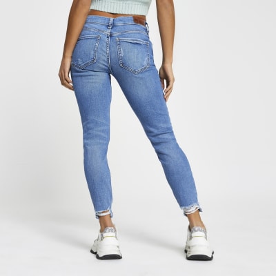 Petite blue Molly rip hem mid rise jeggings