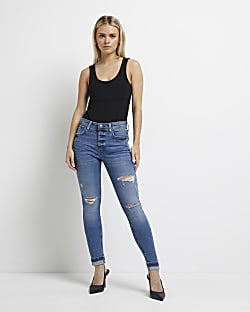 Petite blue ripped mid rise skinny jeans
