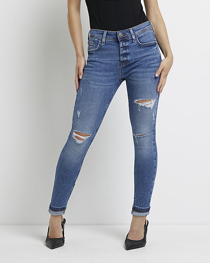 Petite blue ripped mid rise skinny jeans