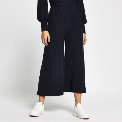 Petite navy wide leg ribbed trousers | River Island