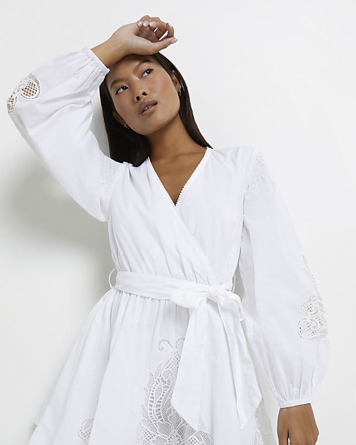 Petite white embroidered wrap mini dress