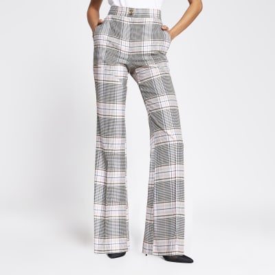 Pink check flare trousers | River Island