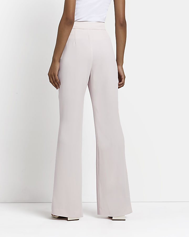 Pink flared trousers
