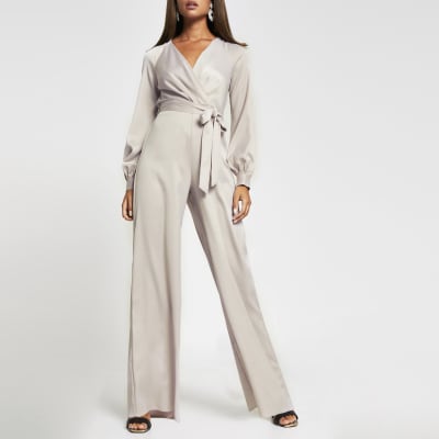 Pink long sleeve satin wrap jumpsuit | River Island