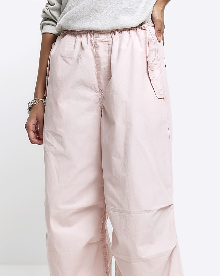 Pink low rise parachute trousers