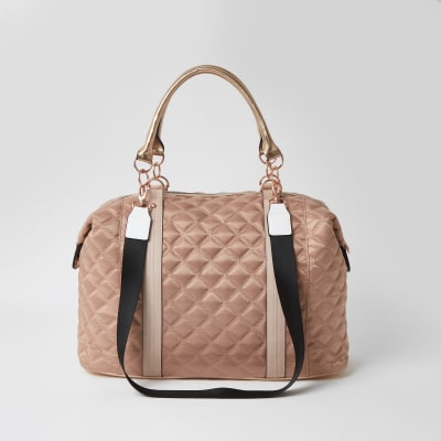 Pink quilted cross body weekend bag