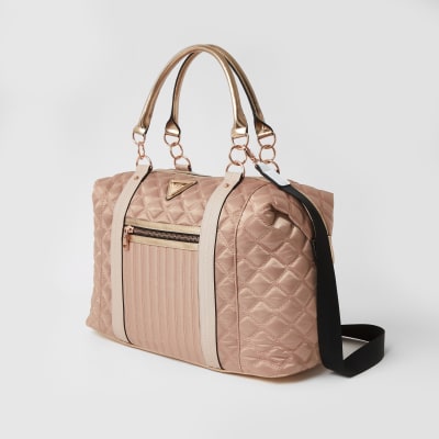 Pink quilted cross body weekend bag