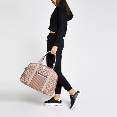 Pink quilted cross body weekend bag