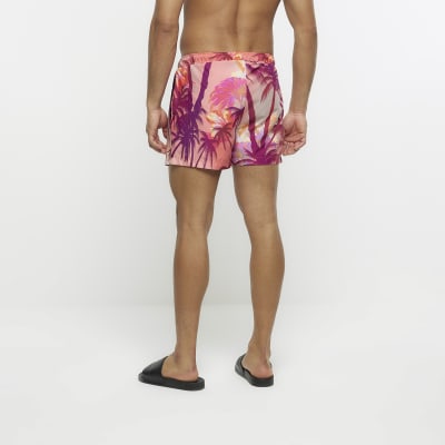 Pink regular fit palm print swim shorts