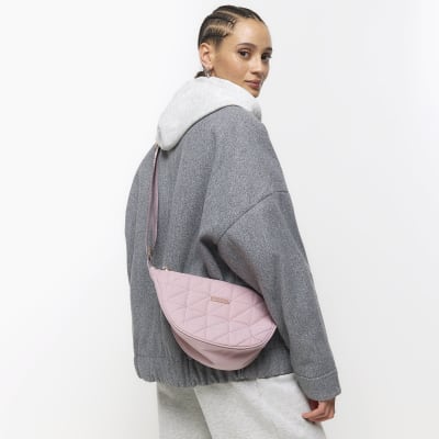 Pink soft quilted cross body bag River Island