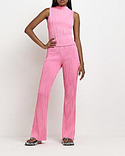 Pink textured flared trousers