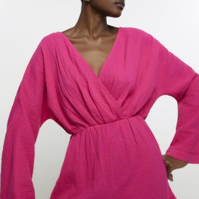 Pink textured wrap playsuit | River Island