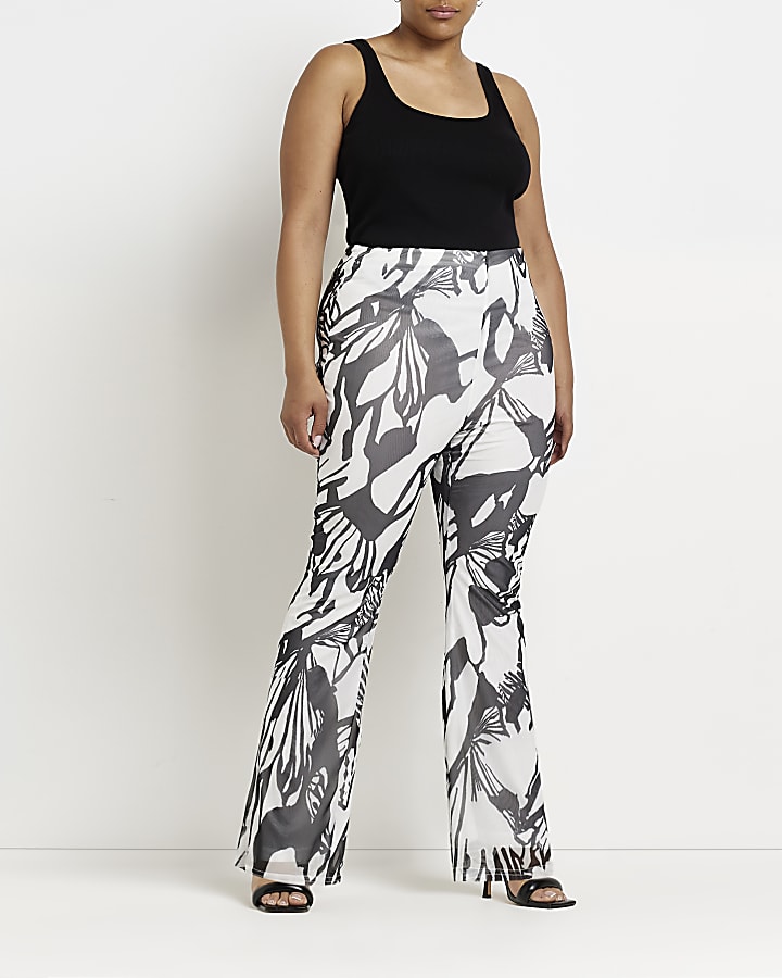 Plus white butterfly print flared trousers