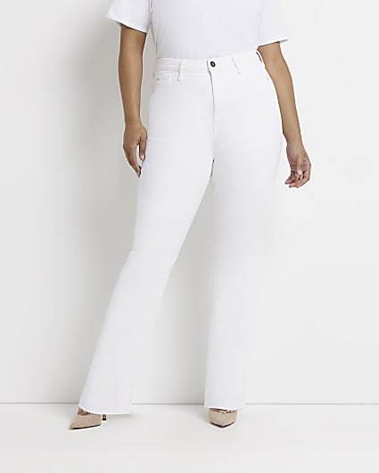 Plus white mid rise flared jeans